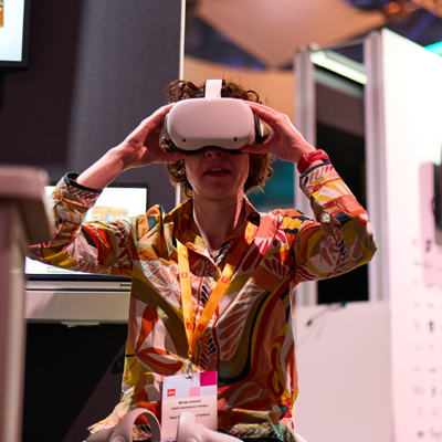 Two delegates looking at a screen.