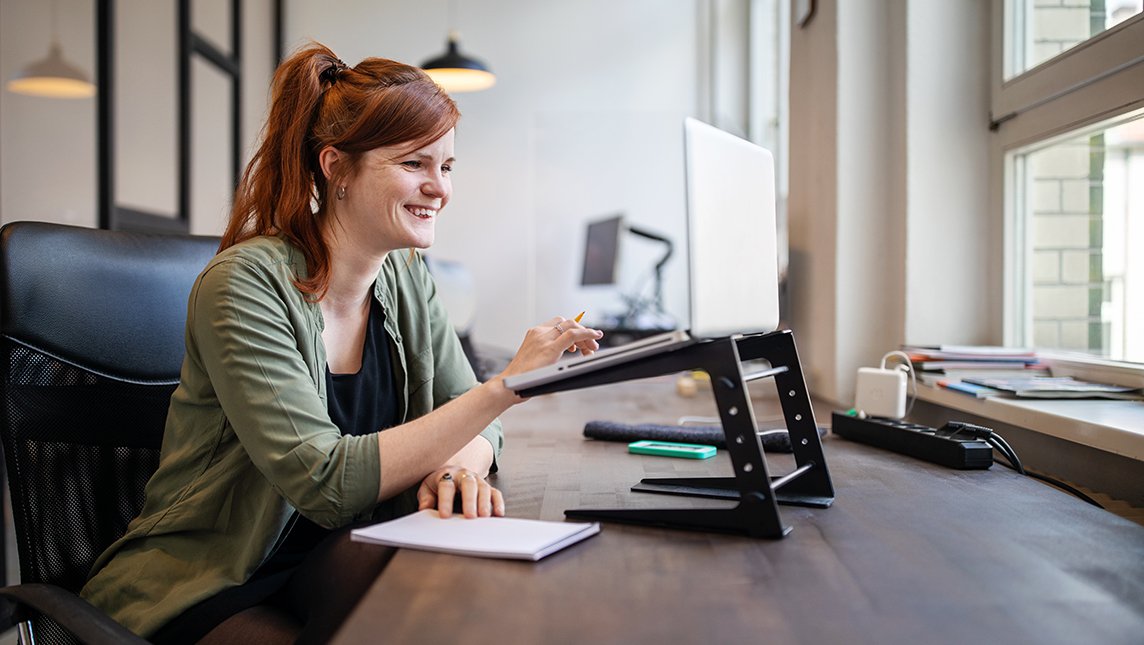 Woman attending online course on her laptop.